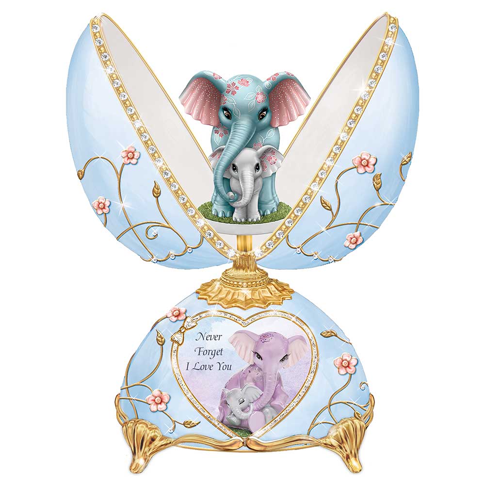 Unforgettable Love pale blue porcelain egg music box open to show mother and baby elephants