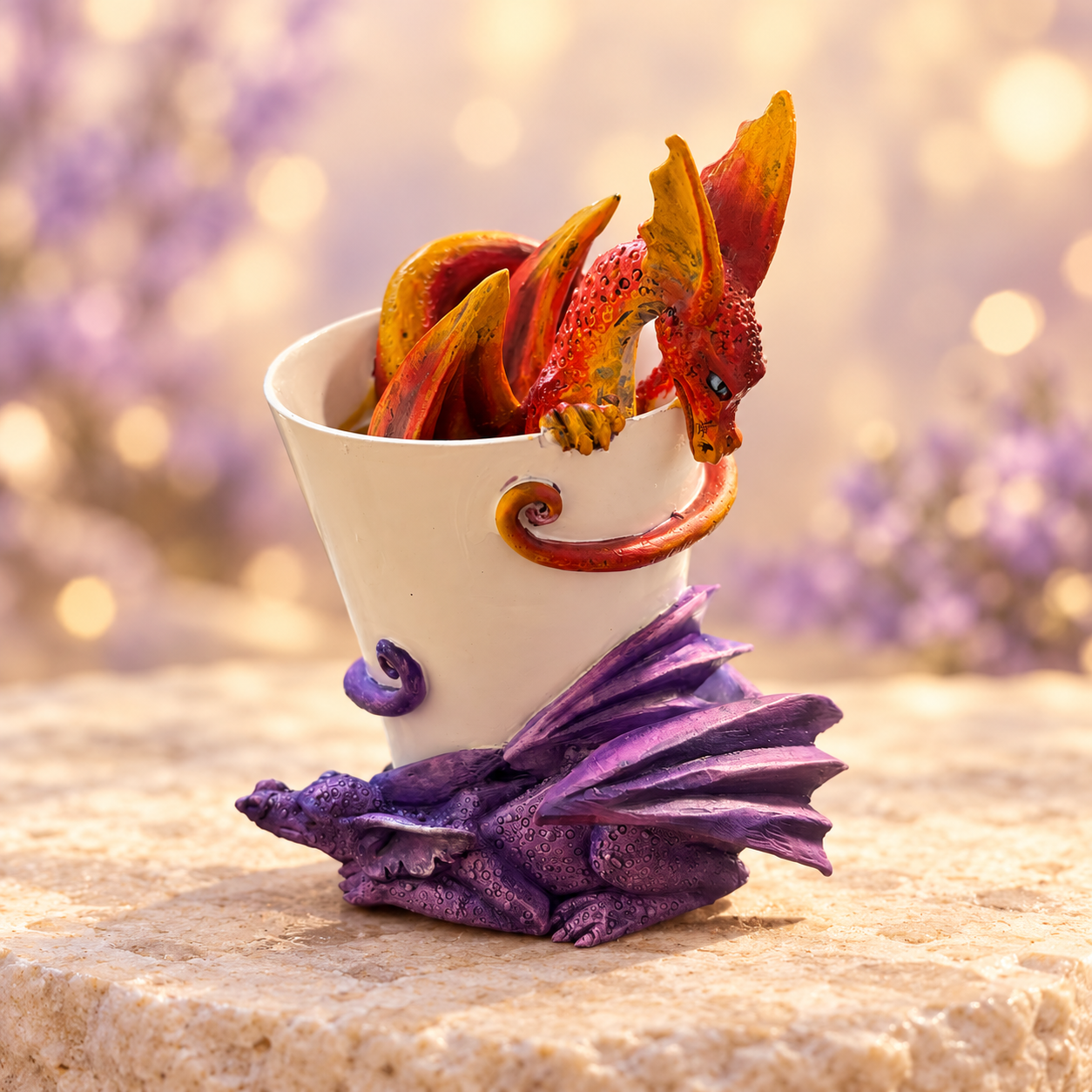 Orange and purple dragons around a cream cup – previously displayed fantasy figurine